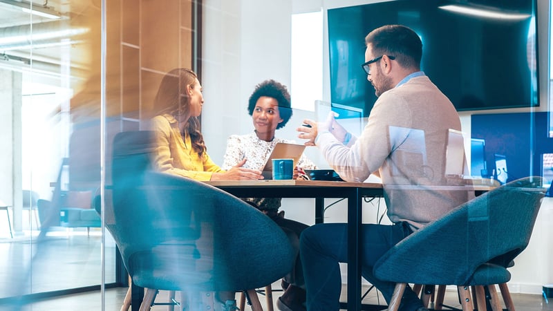 Three lawyers meetging in a conference room