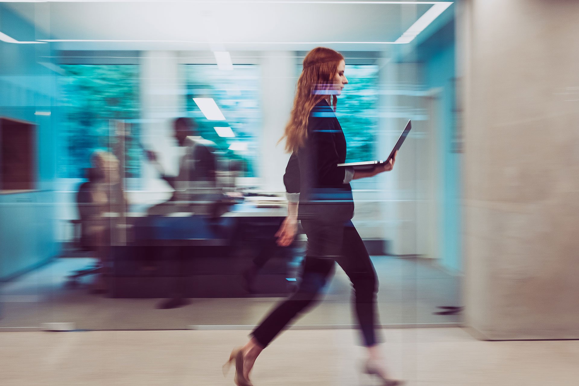 business woman holding laptop